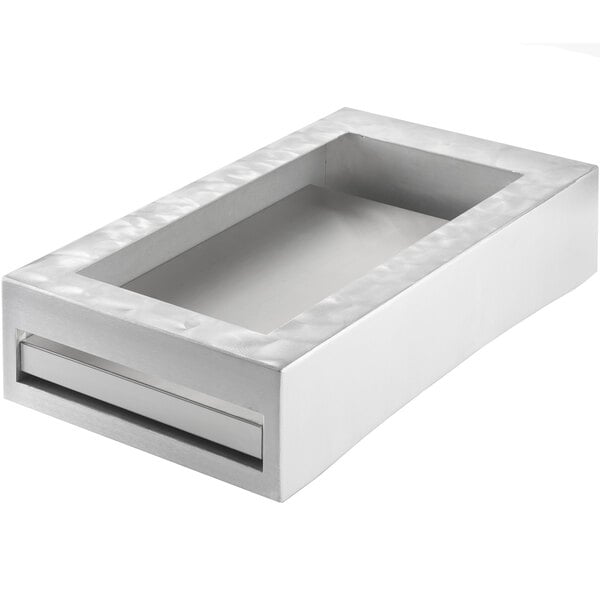A clear rectangular aluminum cooling station with a white surface.