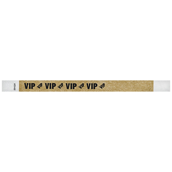 A brown Carnival King Tyvek wristband with black VIP text.