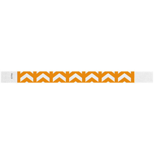 A white wristband with orange arrows and text.
