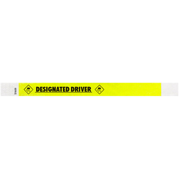 A yellow Tyvek wristband with black text reading "DESIGNATED DRIVER".