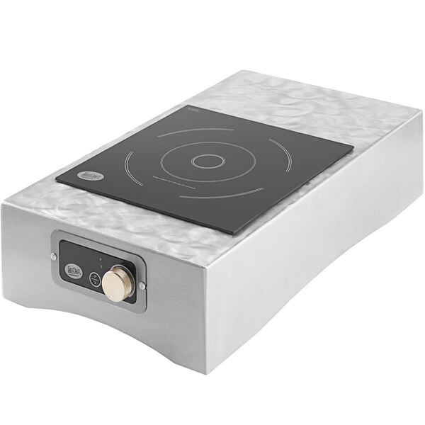 A clear rectangular aluminum induction station with a black square induction cooker on top.