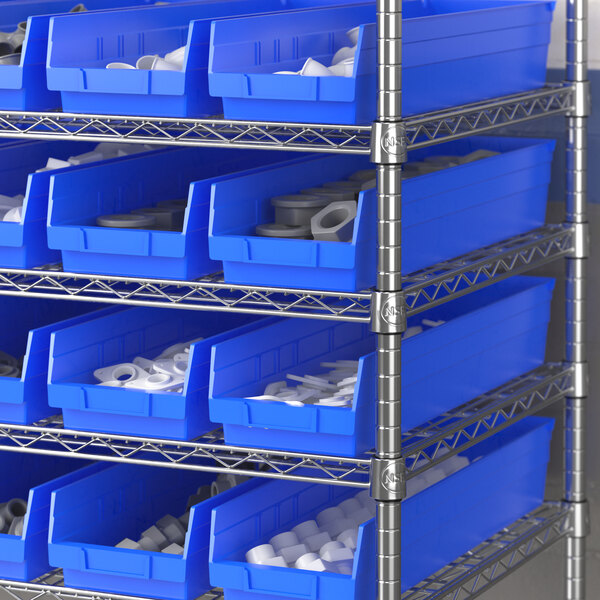 A metal shelf with Regency blue bins holding white and grey objects.