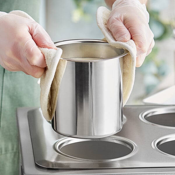 A stainless steel Choice bain marie pot on a stove.
