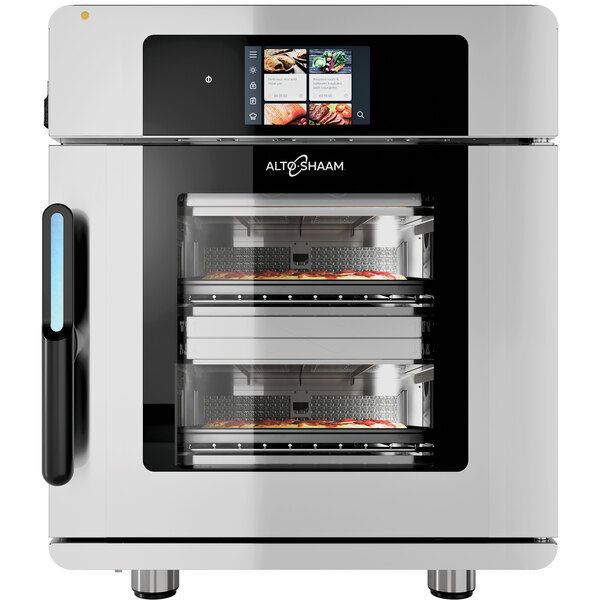 An Alto-Shaam Vector H multi-cook oven with two chambers, one with pizza and one with a food tray.