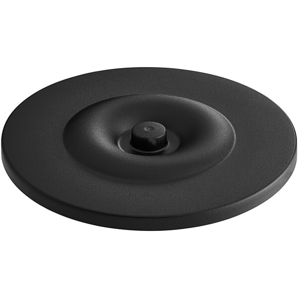 A black circular lid with a round center.