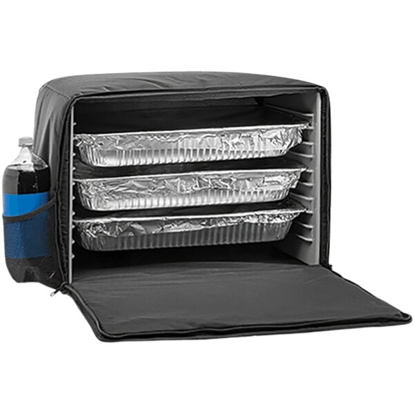 A black Cres Cor electric catering hot bag with foil trays inside.