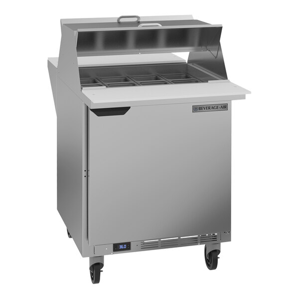 A Beverage-Air stainless steel commercial refrigerator with two open doors on a counter.