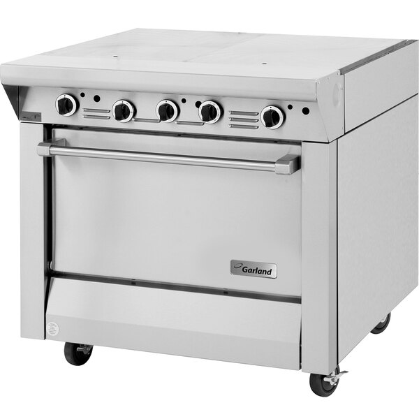 A stainless steel Garland Master Series gas range with hot top and storage base.
