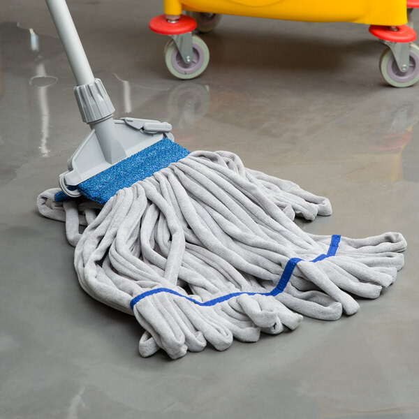 A blue and white Unger SmartColor heavy duty microfiber string mop head on the floor.