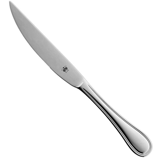 A silver RAK steak knife with a white handle.