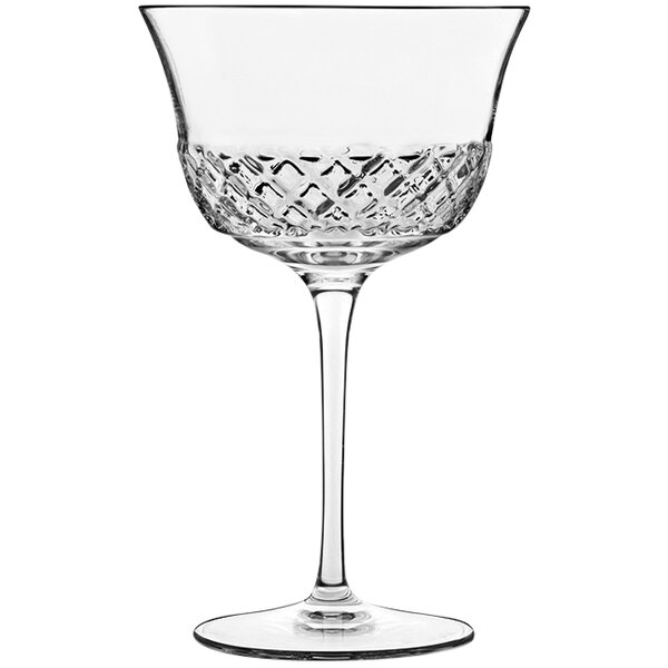 A close-up of a Luigi Bormioli Fizz Cocktail Glass with a diamond pattern.