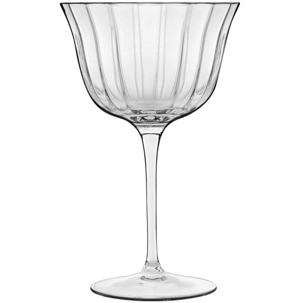 A clear Luigi Bormioli cocktail glass with a rippled rim and long stem.