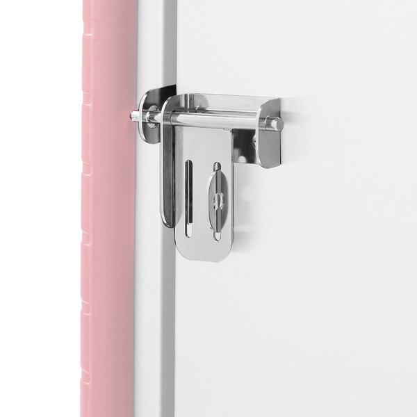 A white refrigerator door with a Metro lockable travel latch attached.