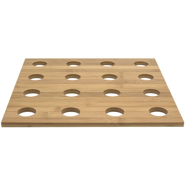 A wooden bamboo board with holes for cones.