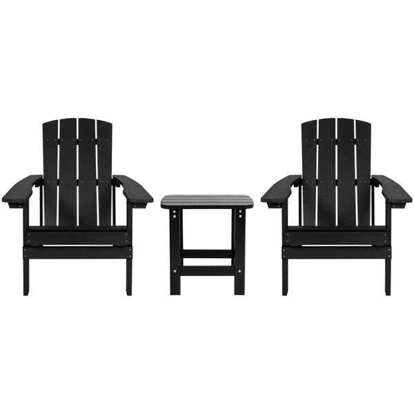 Two black Charlestown Adirondack chairs with a table.