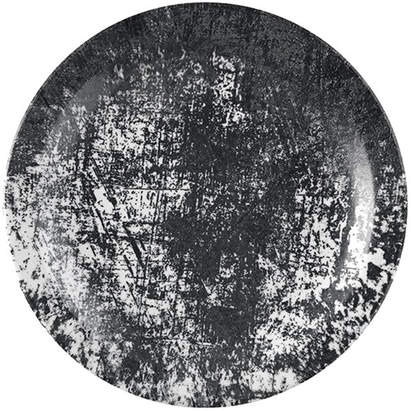 A close-up of a black and white Dudson Maker's Urban china plate with a grunge texture.