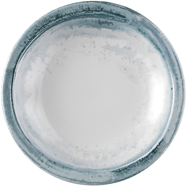 A Dudson Maker's Finca limestone narrow rim china bowl with blue and white speckles.