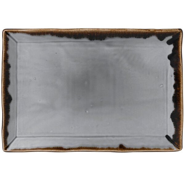 A white rectangular china platter with brown edges.