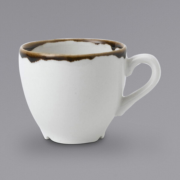 A white espresso cup with a brown rim.