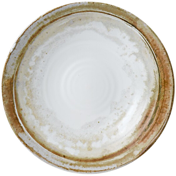 A white Dudson Maker's Finca china plate with a brown rim.