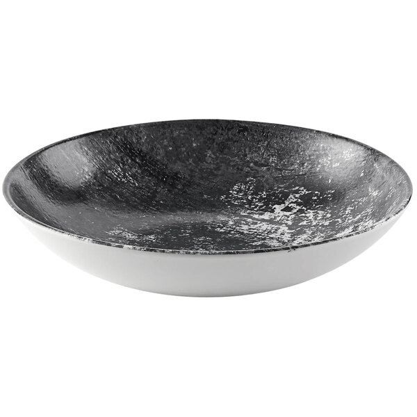 A black and white Dudson Maker's Urban coupe china bowl with a speckled design.