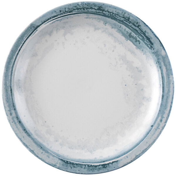 A Dudson Maker's Finca china plate with a white rim and blue accents.