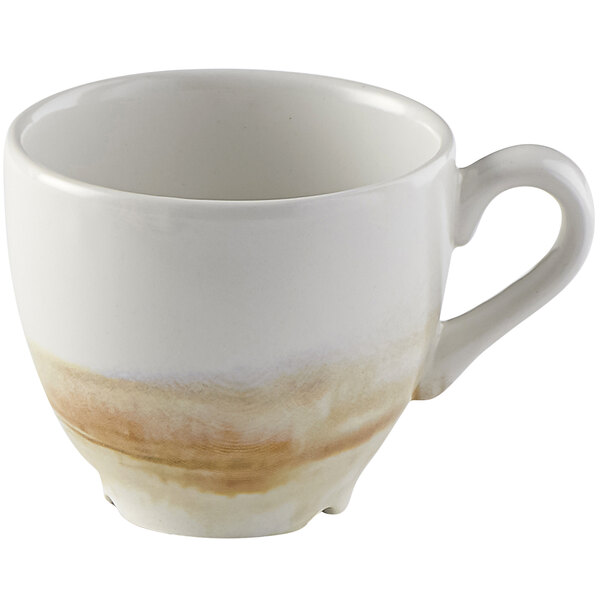 A white espresso cup with brown and white paint on the rim.