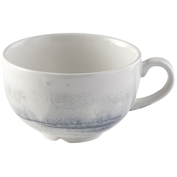 A white Dudson Maker's Finca cappuccino cup with a grey and white design.