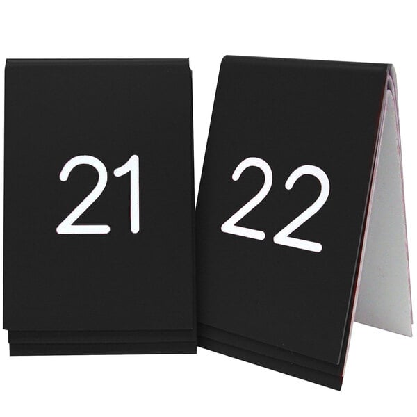A black Cal-Mil table tent sign with white engraved numbers reading "2" and "3"