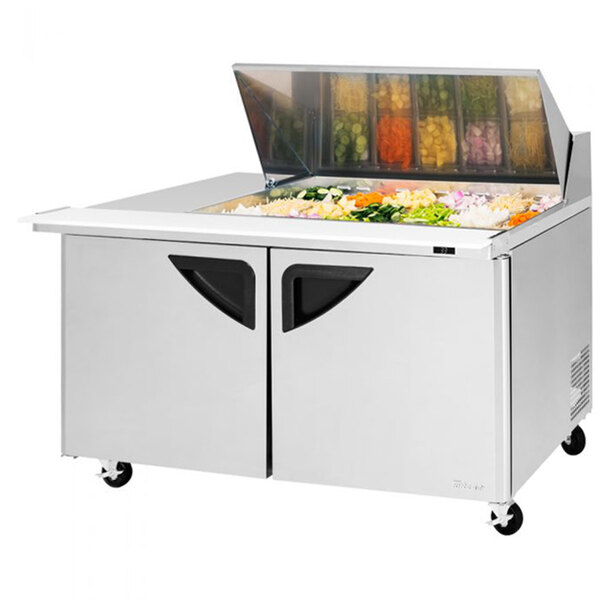 A Turbo Air Mega Top sandwich prep table with a left work station filled with food.