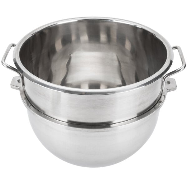 A silver stainless steel Vollrath mixing bowl with two handles.
