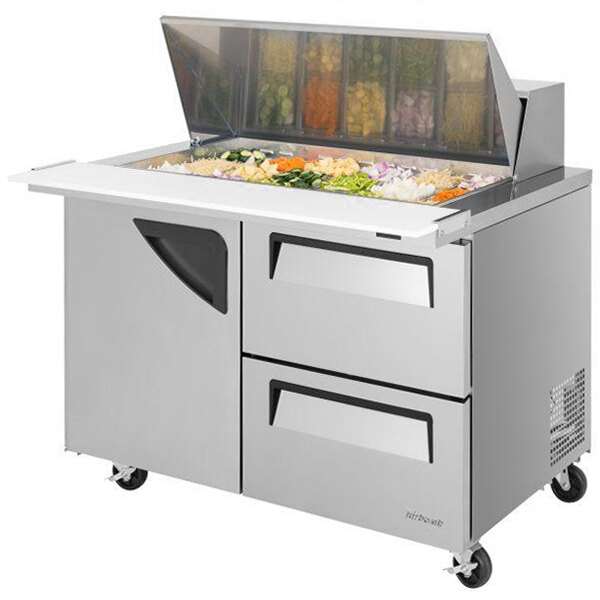 A stainless steel Turbo Air sandwich prep table with a drawer filled with vegetables.