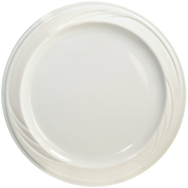 An International Tableware York ivory stoneware plate with a swirl design on the rim.