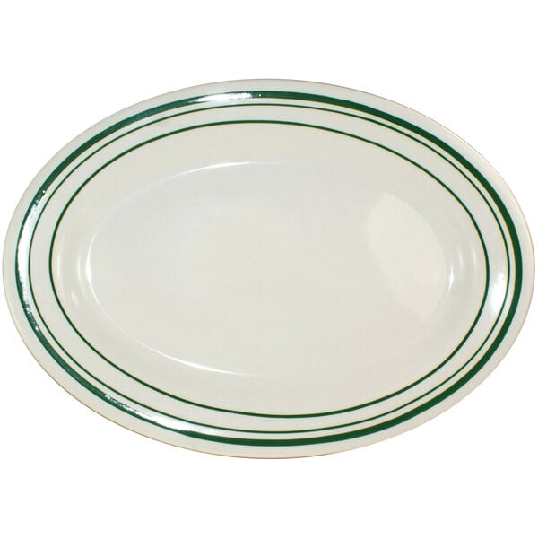An ivory stoneware platter with green bands.