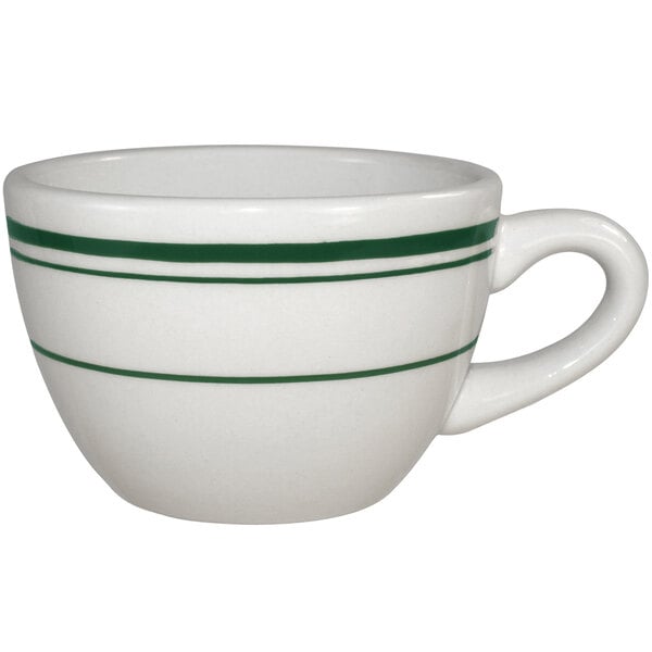 An International Tableware ivory stoneware low cup with a green striped handle.