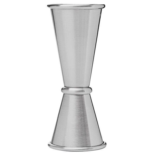A silver metal cup with a handle.
