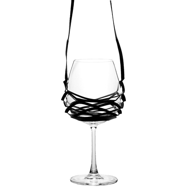 A Franmara Teso wine glass with a black strap around it.