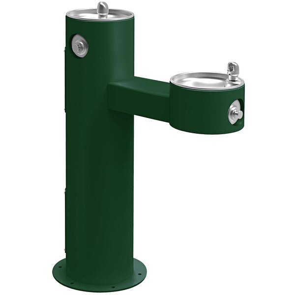 A green Halsey Taylor outdoor drinking fountain with silver handles.