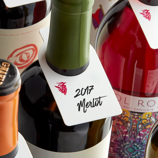 A group of wine bottles with Franmara reusable plastic wine tags on the necks.