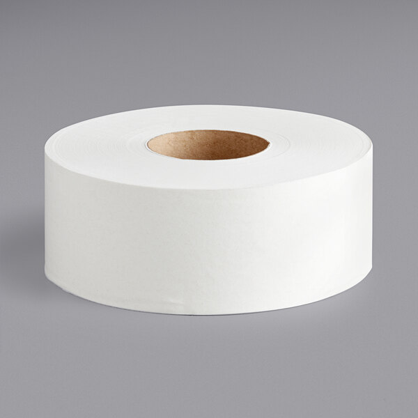 A roll of Pacific Blue Select 2-ply jumbo bathroom tissue on a gray surface.