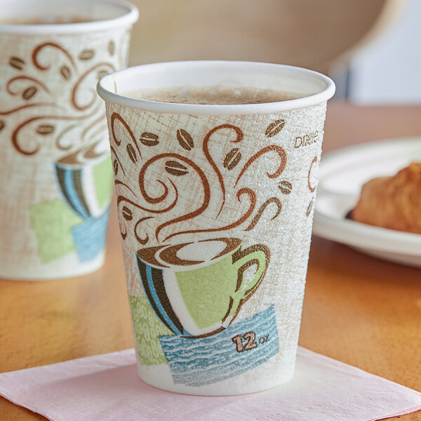 A close-up of two Dixie PerfecTouch paper hot cups with coffee on a napkin.