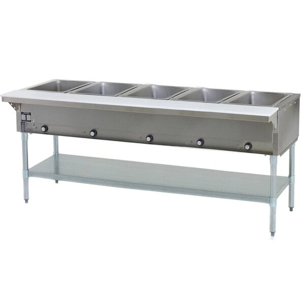 An Eagle Group stainless steel steam table with sealed wells holding five pans on a counter.