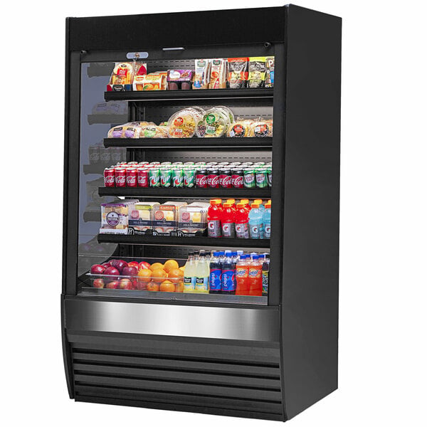 A black Federal Industries refrigerator with different types of food displayed on four shelves.