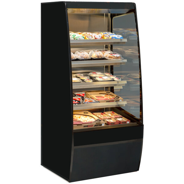 A Federal Industries Vision Series heated self-serve merchandiser with food on shelves in a deli.