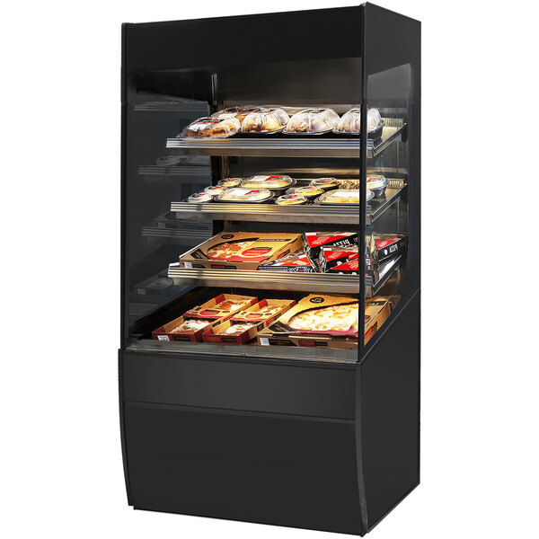 A black Federal Industries heated self-serve display case with food on shelves.