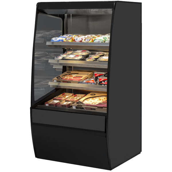 A Federal Industries Vision Series curved heated self-serve merchandiser with food on shelves.