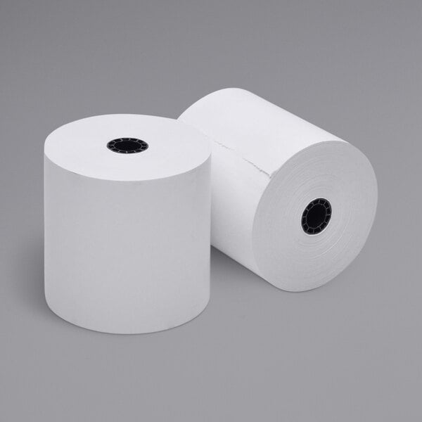 Two rolls of white Point Plus cash register paper on a white background.