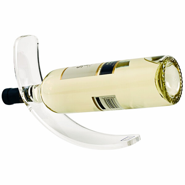 A Franmara clear acrylic curved wine bottle stand holding a bottle of wine.