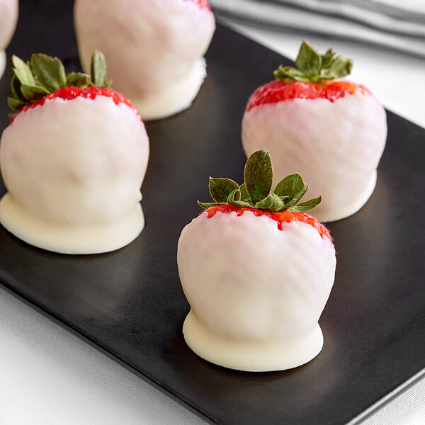 A tray of strawberries covered in Van Leer White Confectionary Coating.