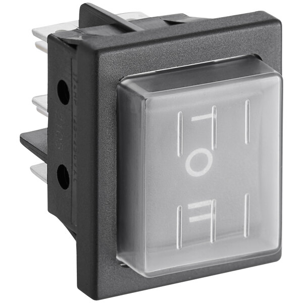 A close up of a Galaxy black and white rocker switch with a clear plastic cover.